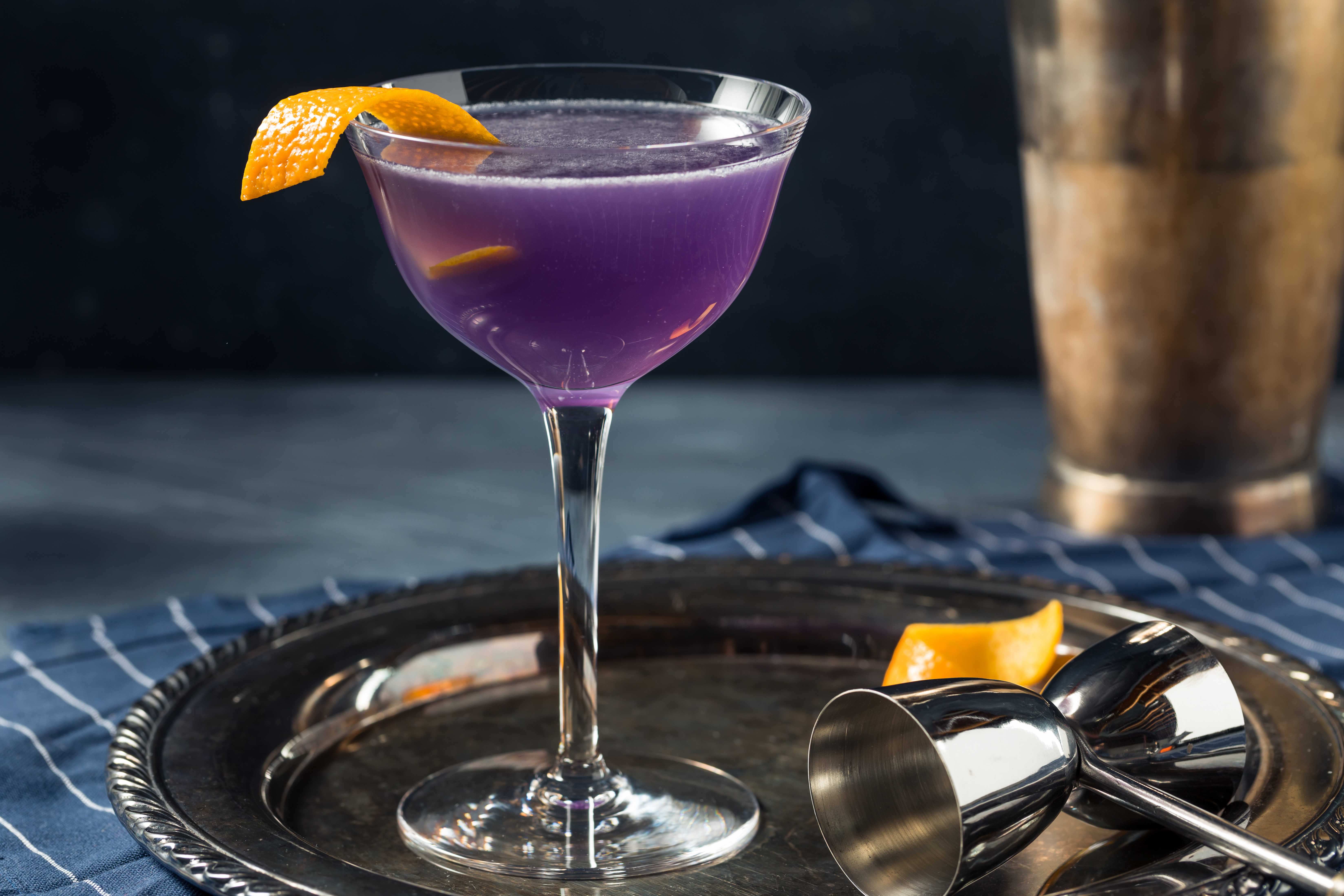 A violet-hued cocktail in a glass