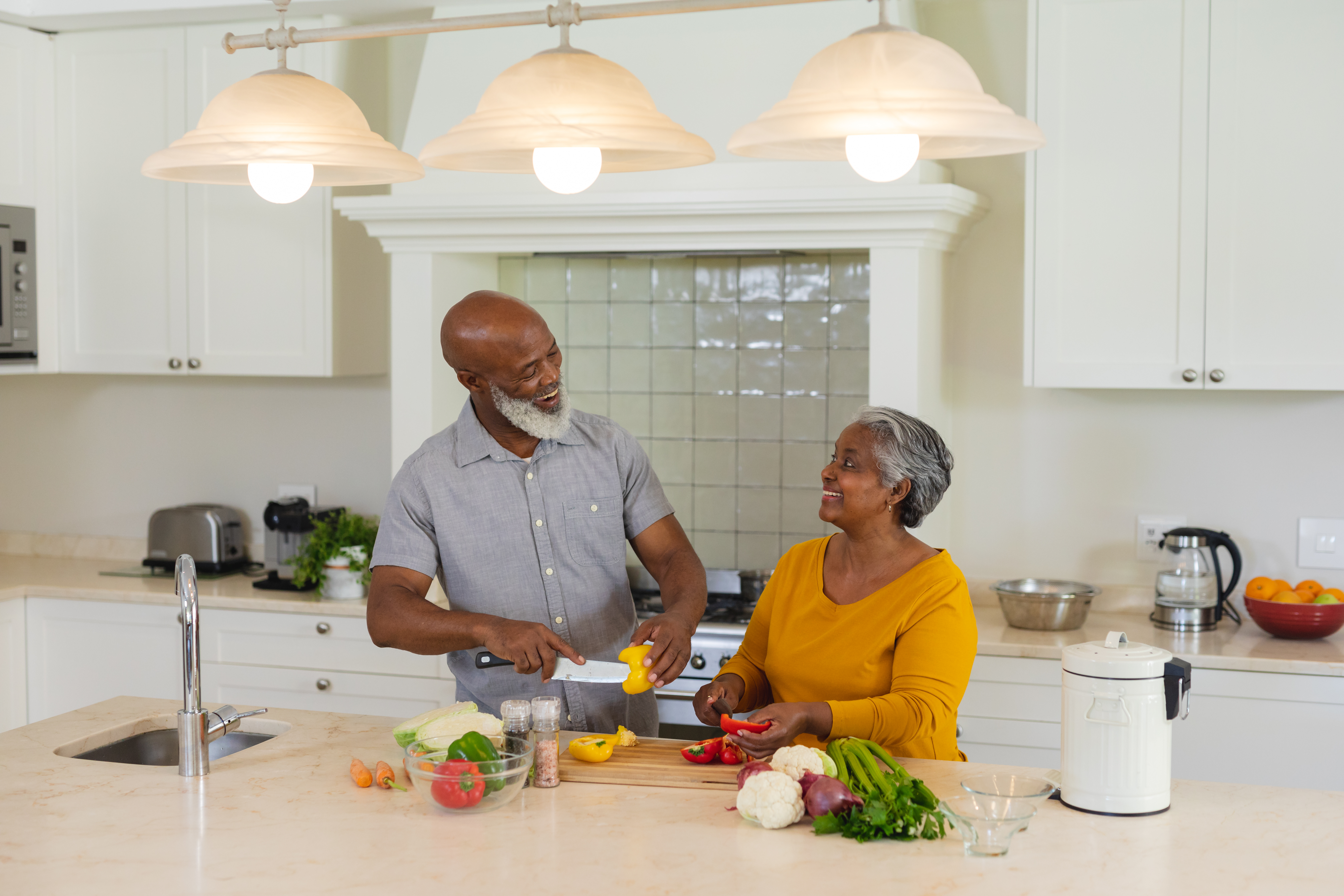 A couple cooking together in the kitchen
