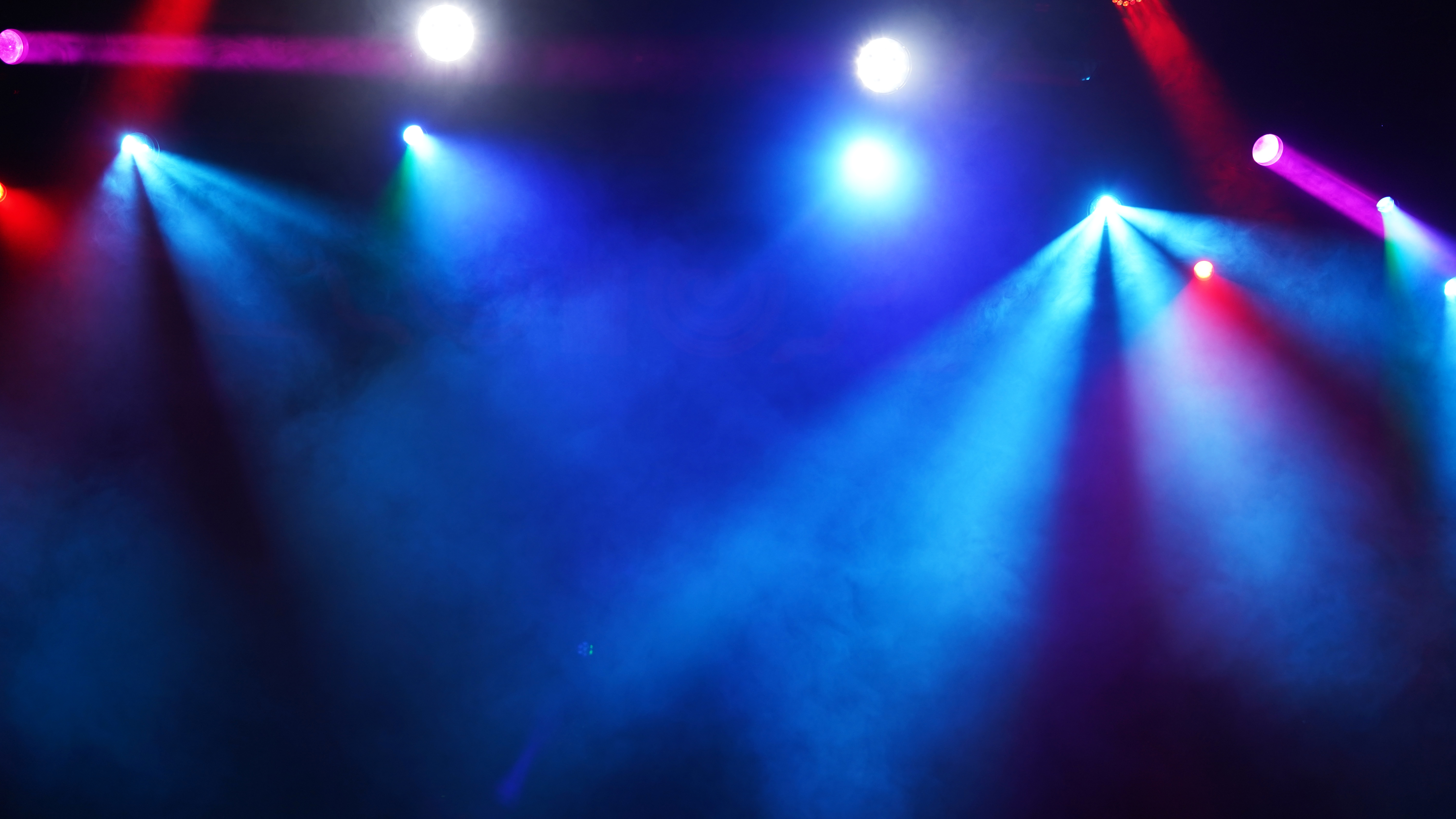 Setting up lights on an empty concert stage