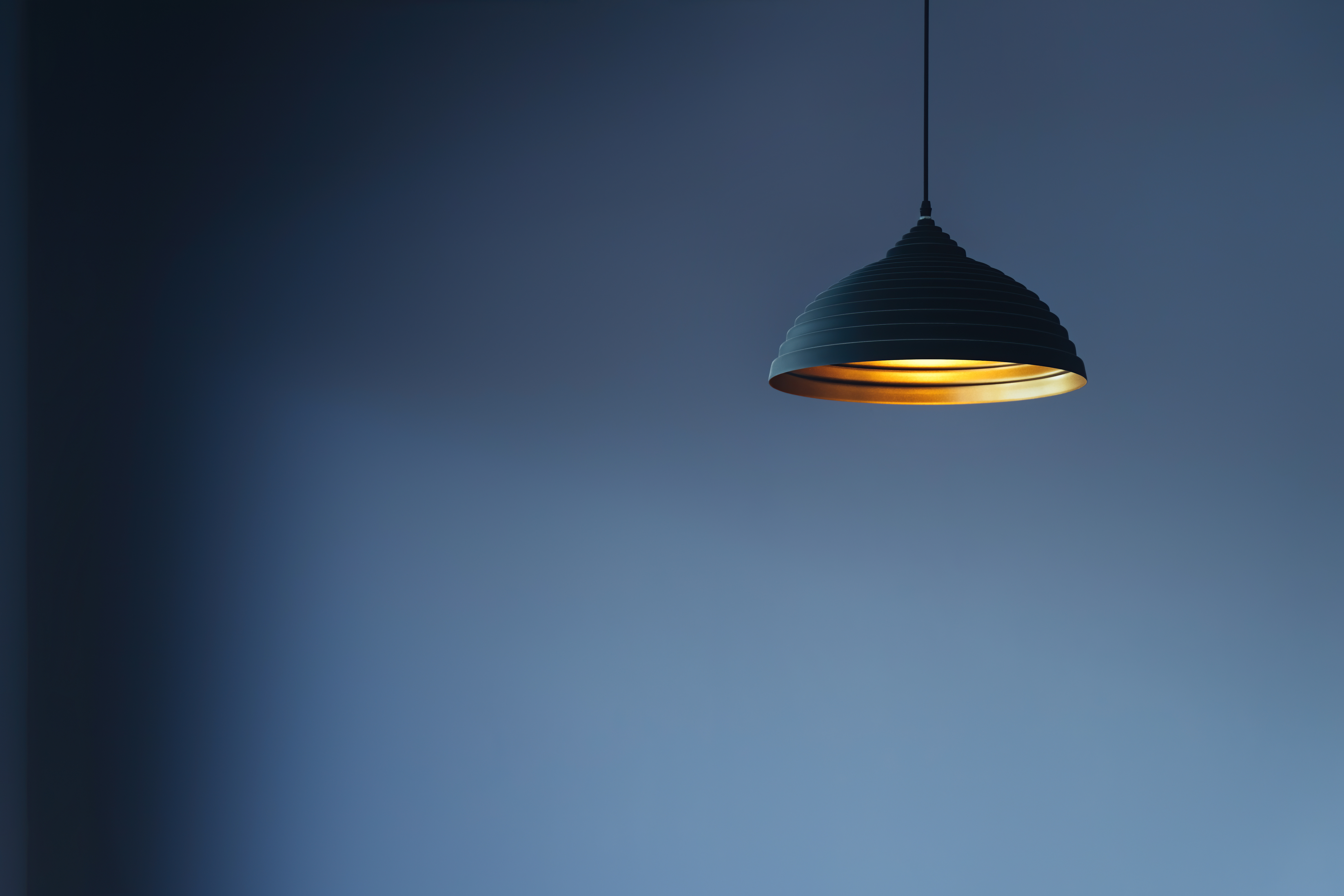A warm lamp glowing in a dark room